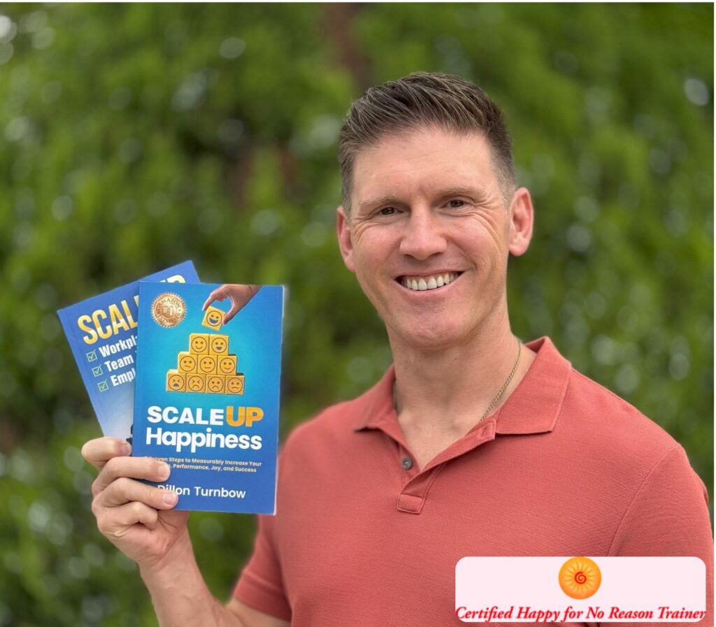 Dillon Turnbow certified happy for no reason trainer holding his two bestselling books